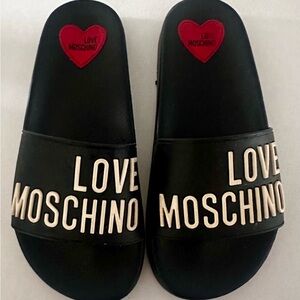 LOVE MOSCHINO logo-embossed open toe slides size 7